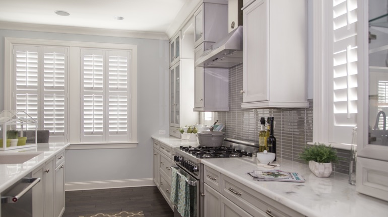 Polywood shutters in Atlanta kitchen with white cabinets.